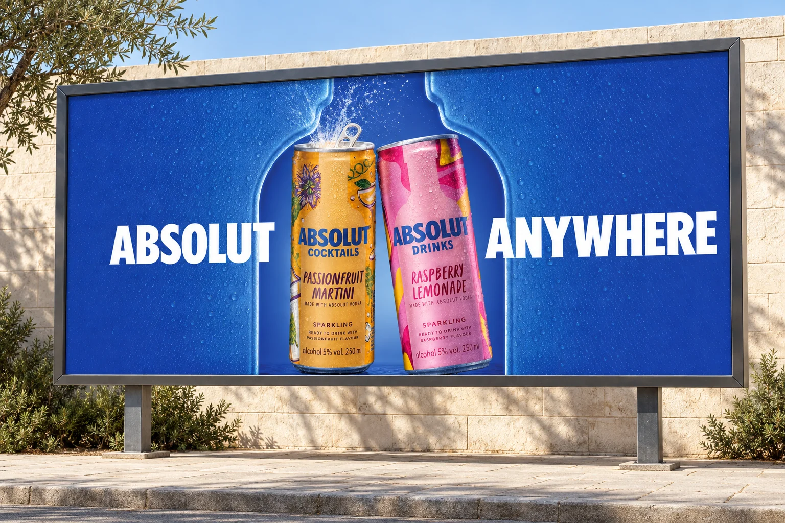 Taş duvar önündeki ayaklı billboard üzerinde Absolut tasarımının mockup sunumu